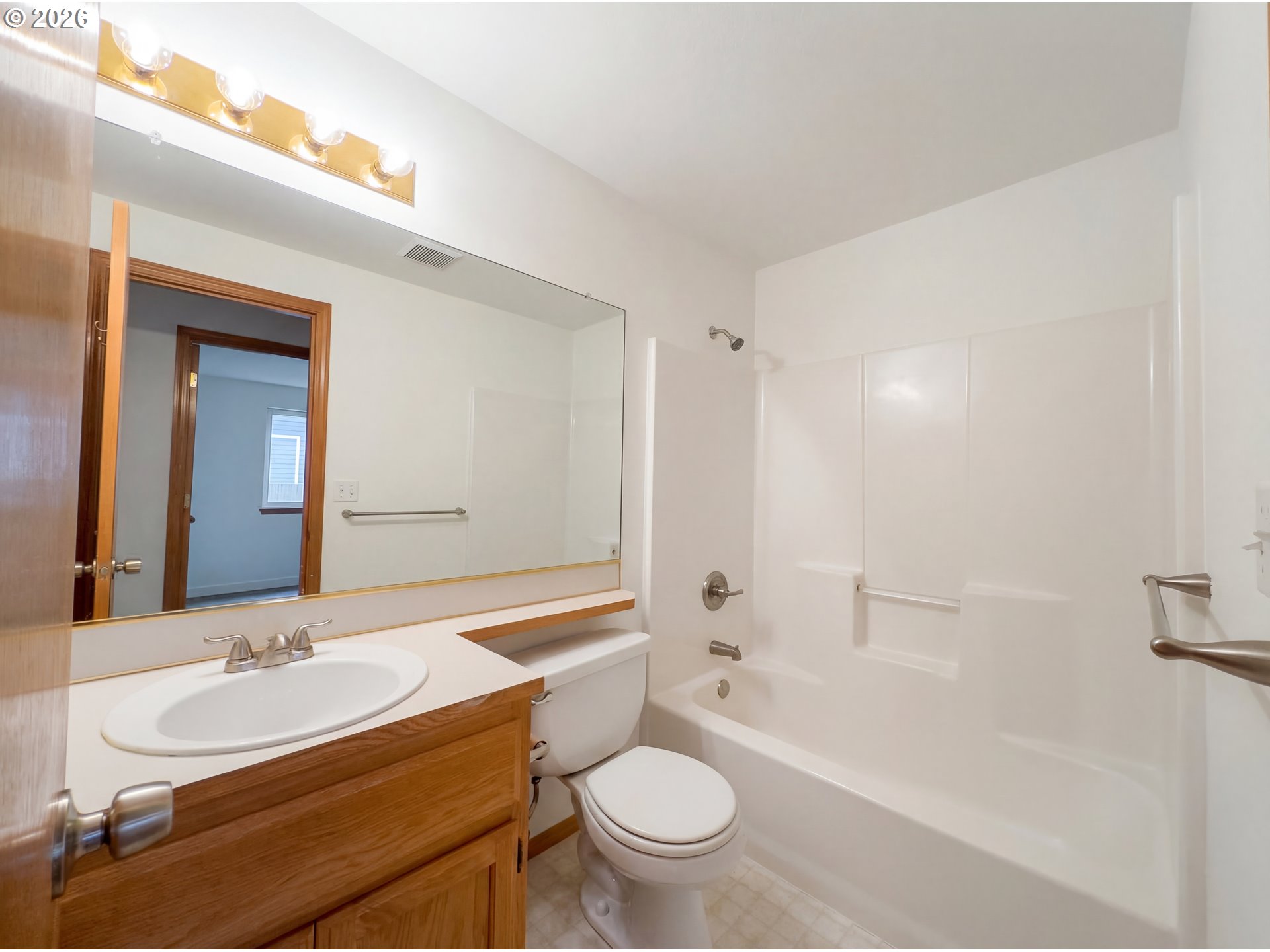 8641 Northeast Windstone Street Beaverton, OR 97006 - Photo 10 of 18 a bathroom with a sink a toilet and shower