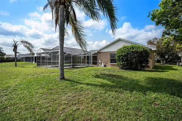 a view of a house with a backyard