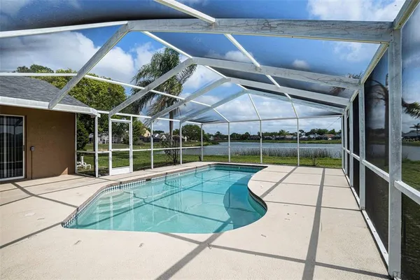 a view of a backyard with a swimming pool