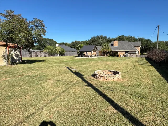 a view of a swimming pool and an outdoor space
