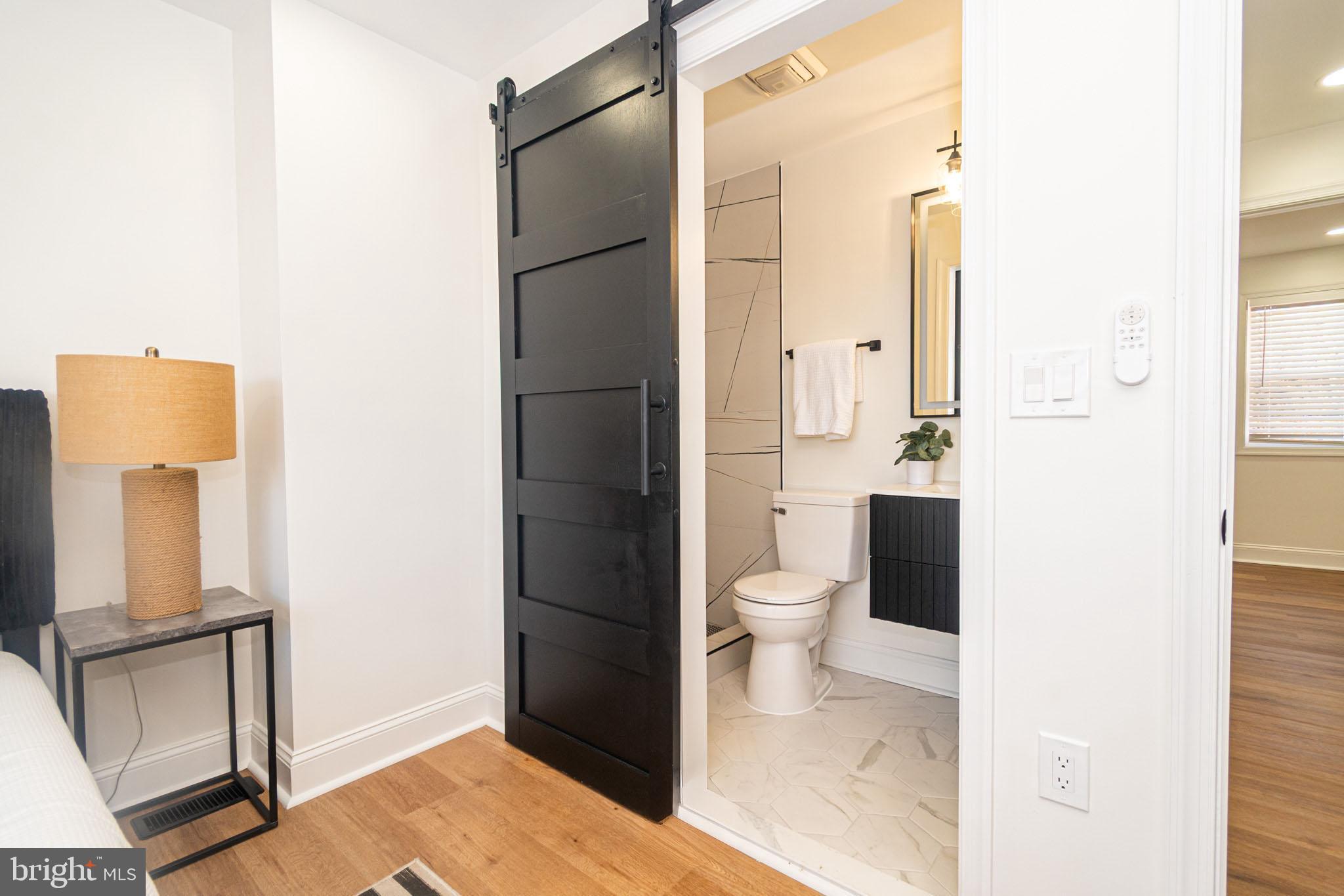 2560 Cecil Avenue Baltimore, MD 21218 - Photo 8 of 11 a bathroom with a toilet and a shower