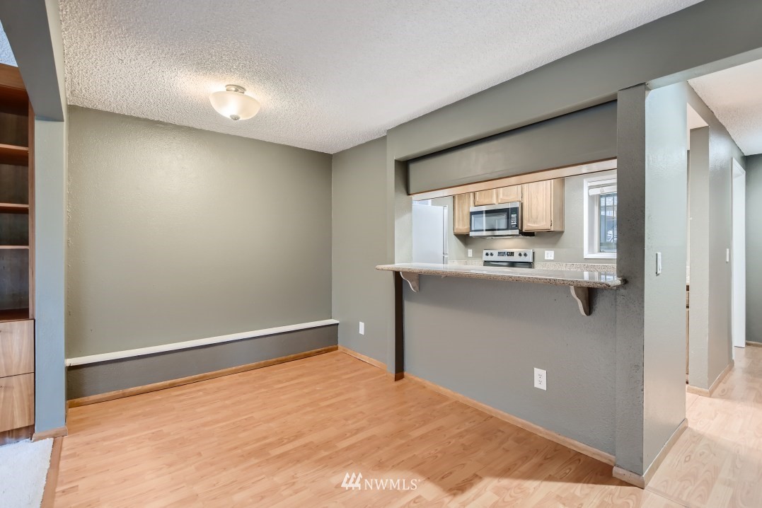 7577 Old Redmond Road, Unit 7 Redmond, WA 98052 - Photo 8 of 21 a view of kitchen with stainless steel appliances cabinets