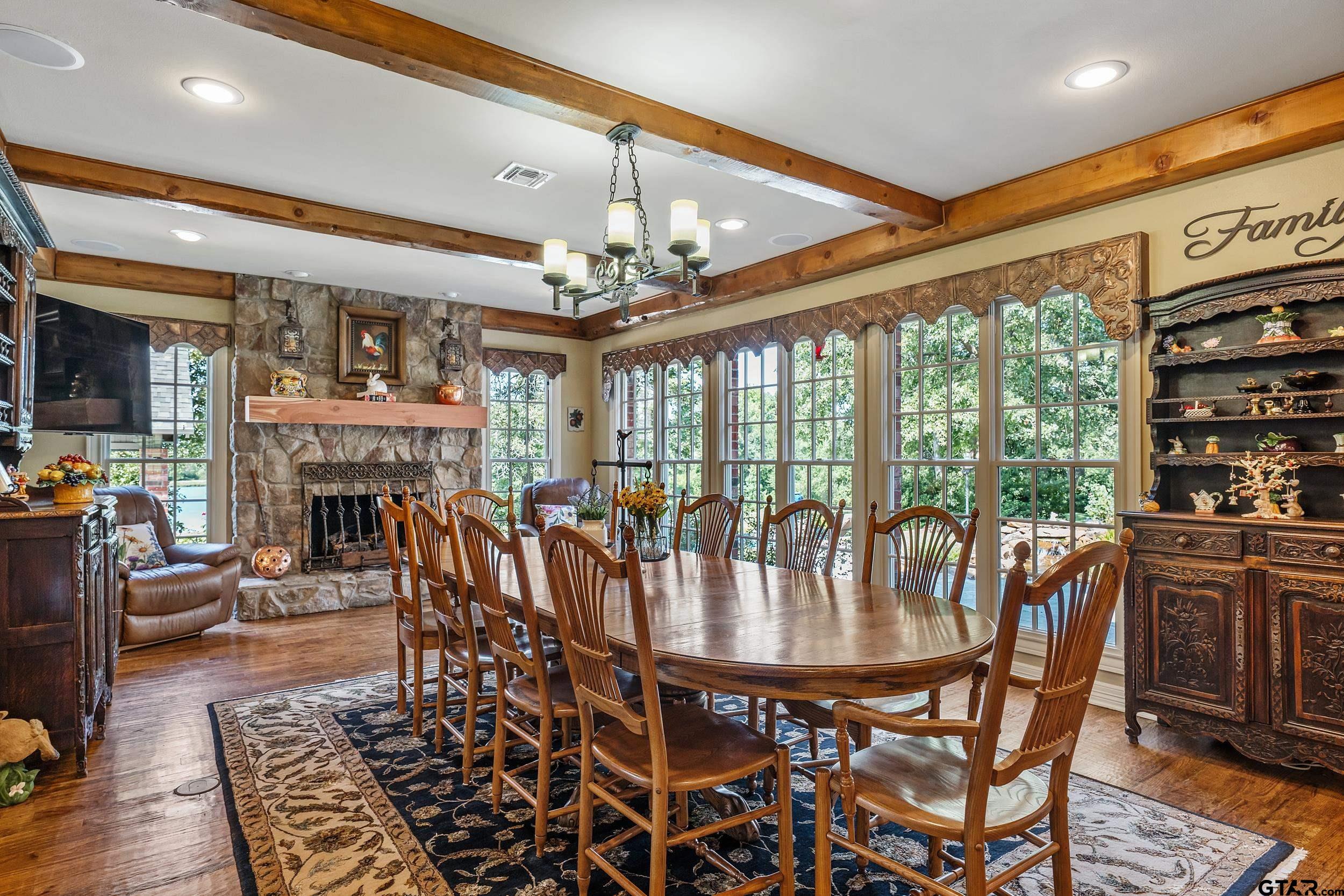 535 Riata Road Bullard, TX 75757 - Photo 13 of 47 a dining room with furniture a fireplace and chandelier