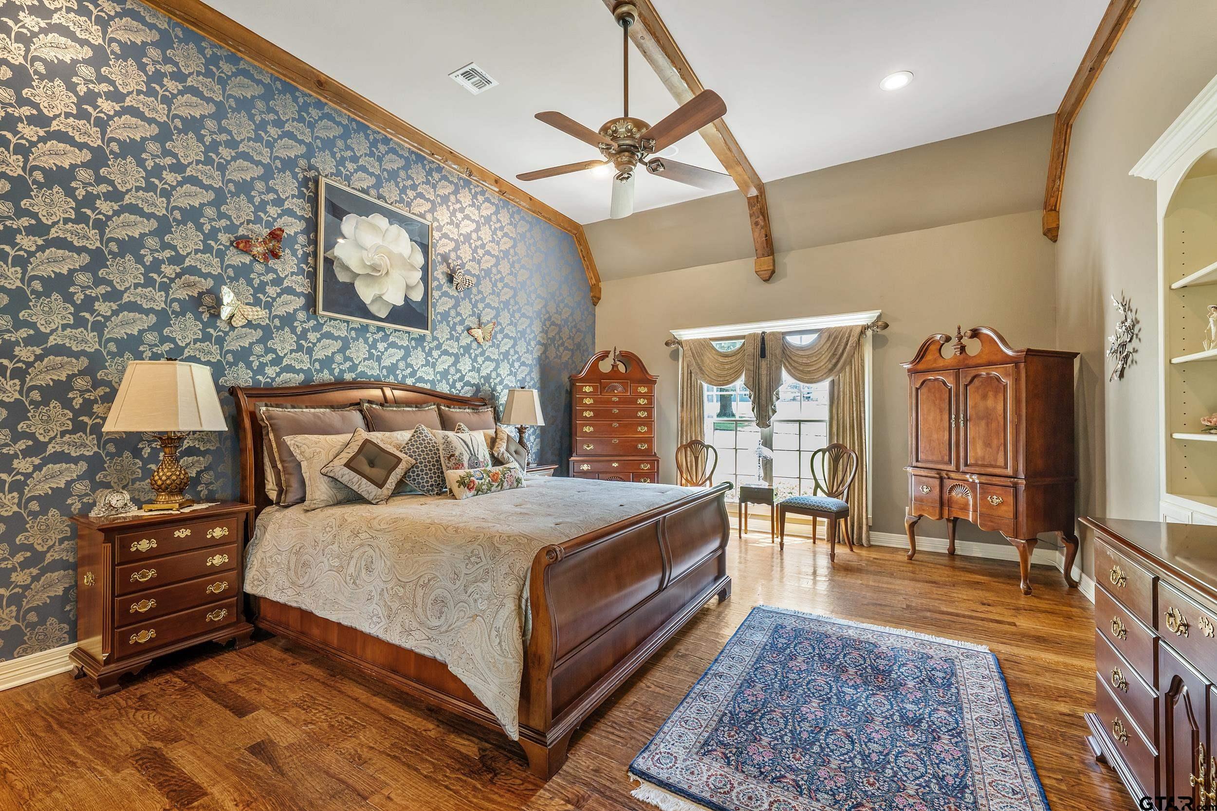 535 Riata Road Bullard, TX 75757 - Photo 15 of 47 a bedroom with a bed a mirror and a desk