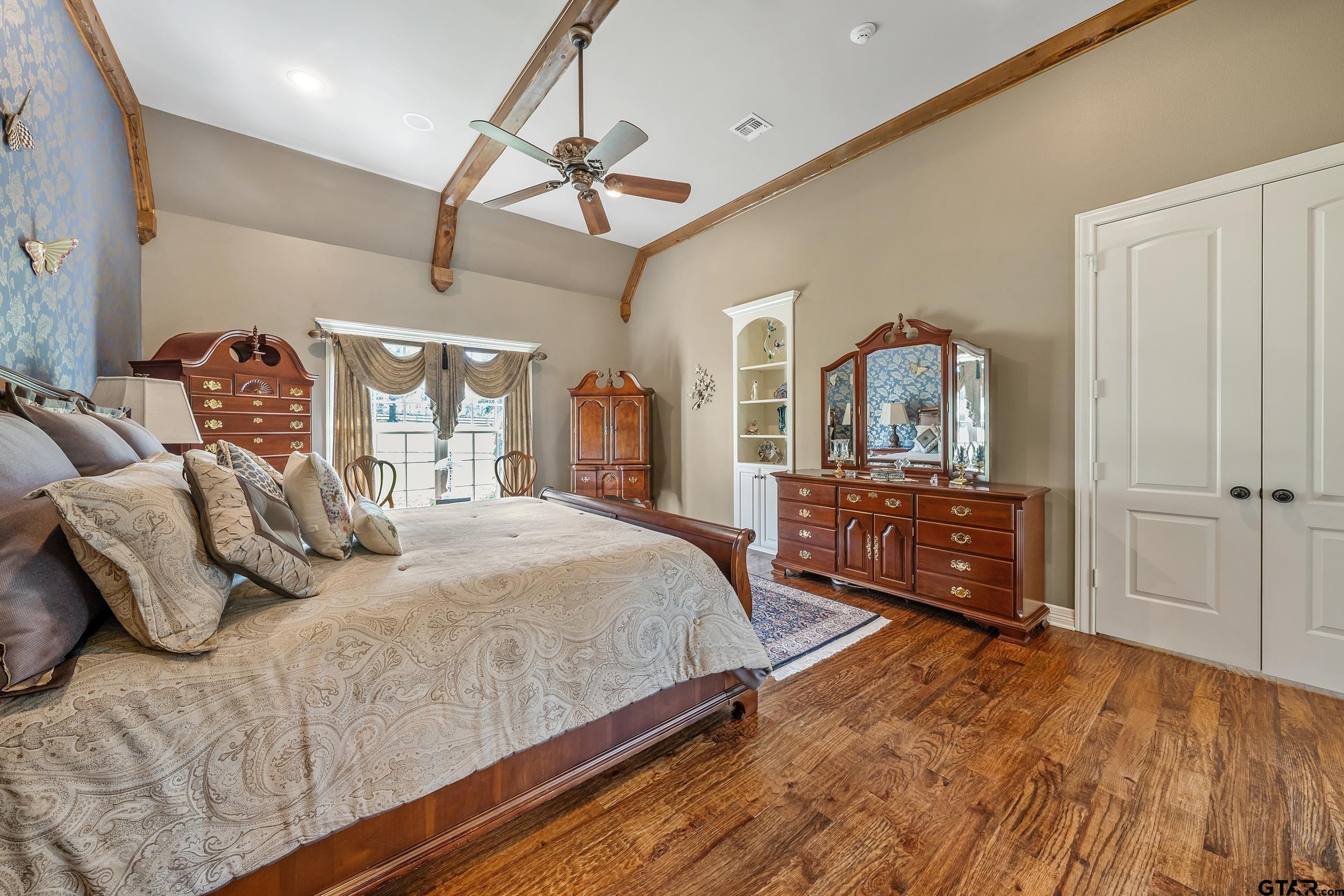 535 Riata Road Bullard, TX 75757 - Photo 16 of 47 a bedroom with a bed and a dresser with mirror