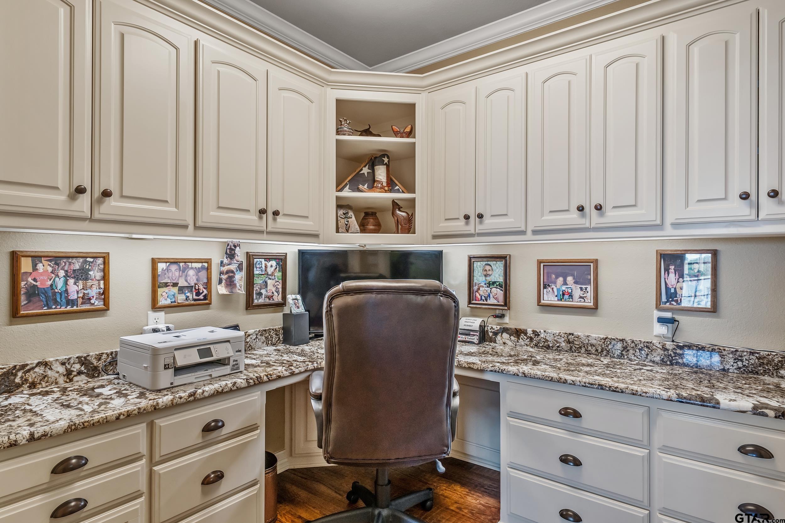 535 Riata Road Bullard, TX 75757 - Photo 33 of 47 a kitchen with granite countertop white cabinets and sink