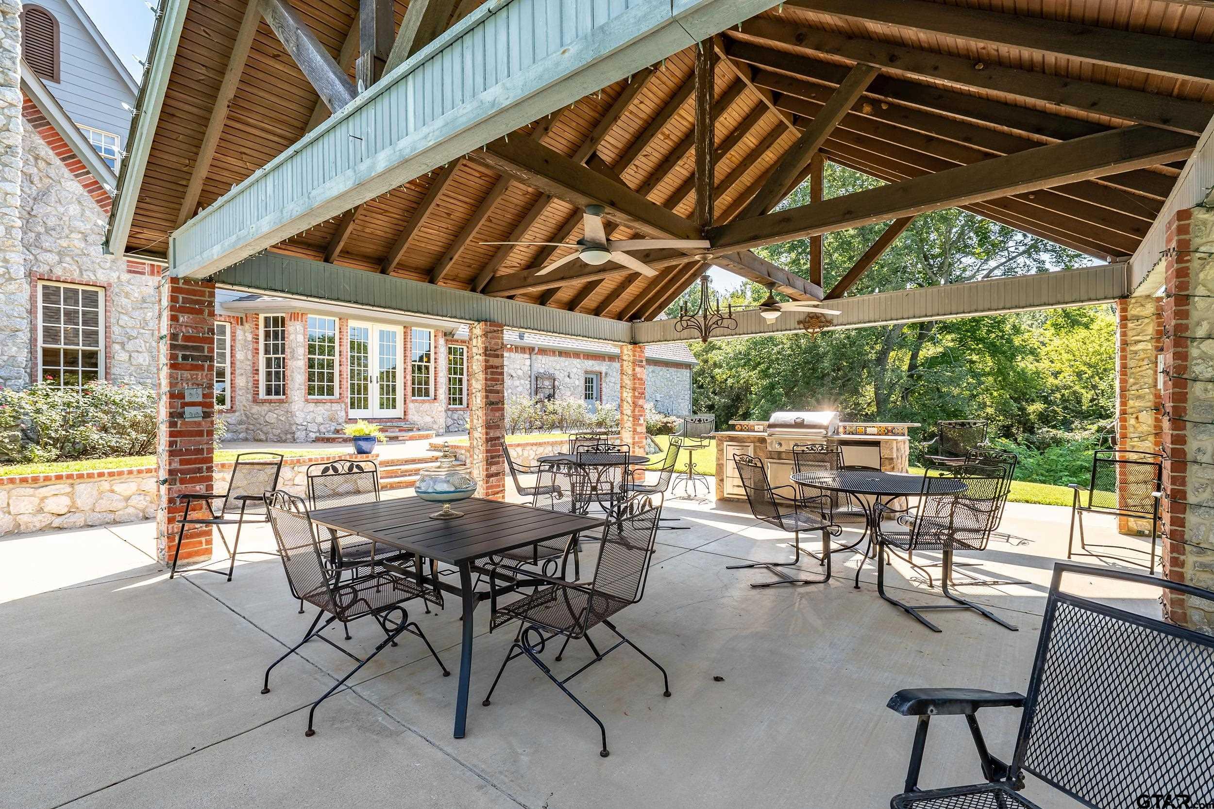 535 Riata Road Bullard, TX 75757 - Photo 38 of 47 a view of a patio with a table and chairs and a barbeque