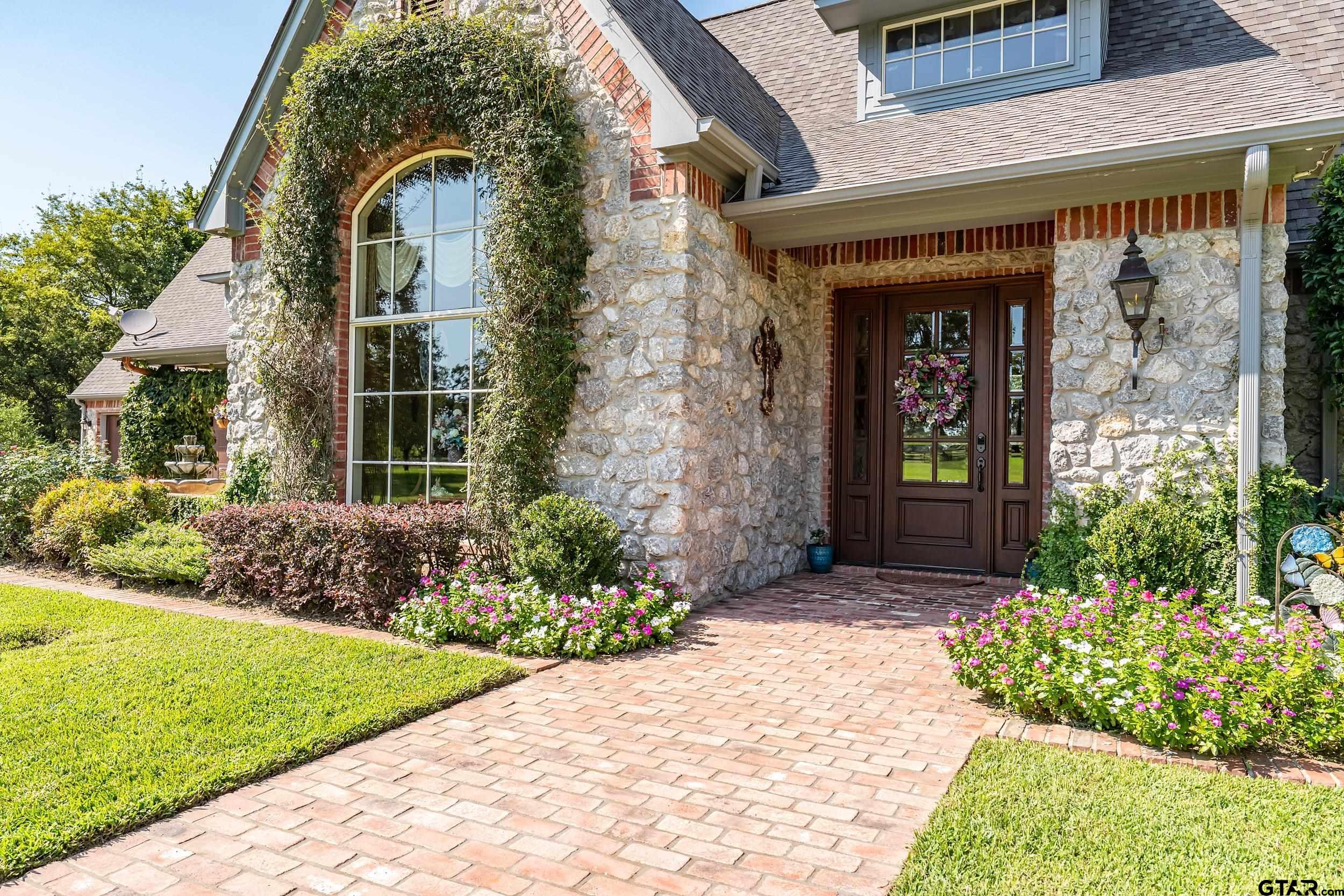 535 Riata Road Bullard, TX 75757 - Photo 5 of 47 a front view of a house with garden