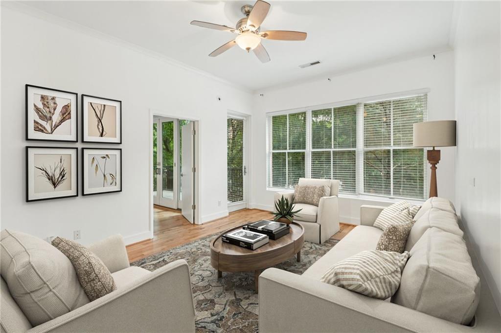 384 Ralph McGill Boulevard Northeast, Unit 105 Atlanta, GA 30312 - Photo 1 of 29 a living room with furniture and a large window