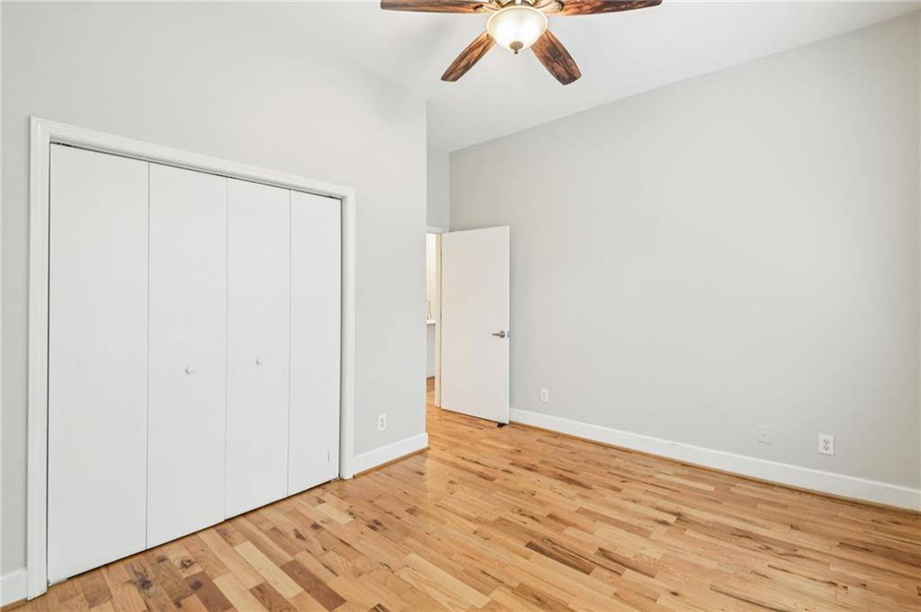384 Ralph McGill Boulevard Northeast, Unit 105 Atlanta, GA 30312 - Photo 17 of 29 a view of empty room with wooden floor