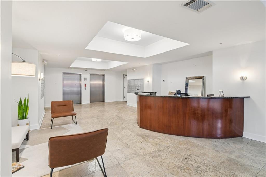 384 Ralph McGill Boulevard Northeast, Unit 105 Atlanta, GA 30312 - Photo 25 of 29 a living room with furniture and a table