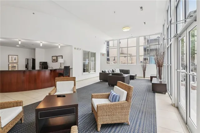 a living room with furniture and a large window