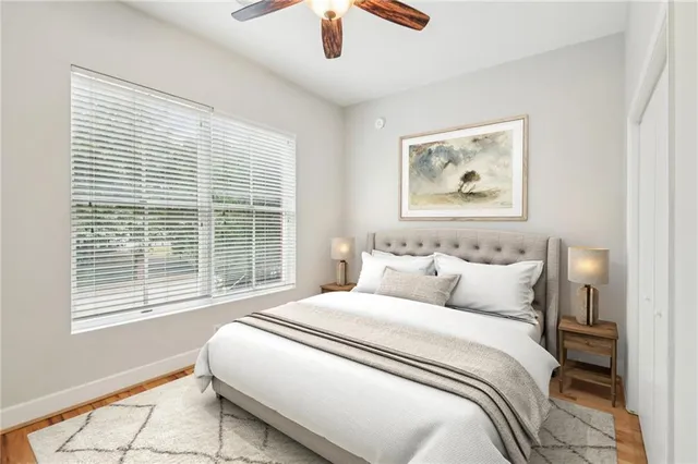 a bedroom with bed and a window