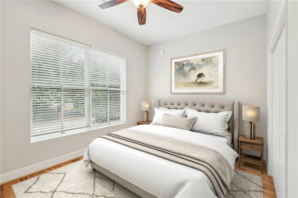 384 Ralph McGill Boulevard Northeast, Unit 105 Atlanta, GA 30312 - Photo 3 of 29 a bedroom with bed and a window