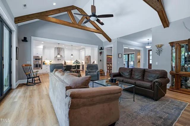 a kitchen with granite countertop stainless steel appliances a stove a sink and a counter space