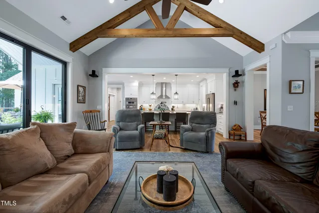 a kitchen with stainless steel appliances granite countertop a stove and white cabinets