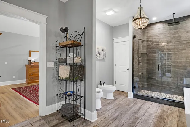 a view of a workspace with furniture and a flat screen tv