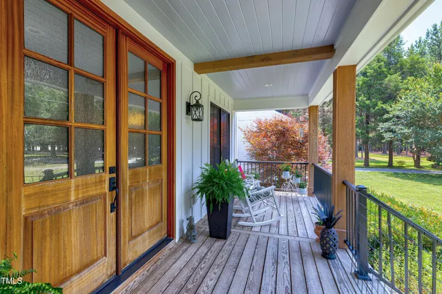 a living room with furniture wooden floor and a fireplace