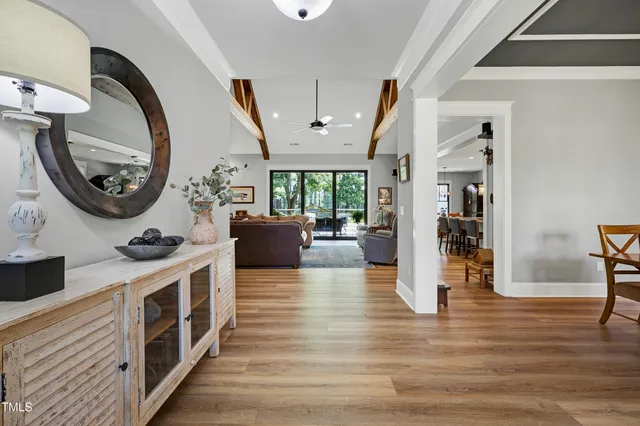 a living room with fireplace furniture and a flat screen tv