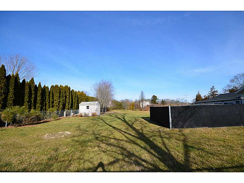 39 Brayton Road Tiverton, RI 02878 - Photo 24 of 24 Exterior Back. Tree lined fenced garden shed