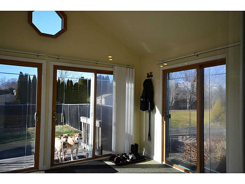 39 Brayton Road Tiverton, RI 02878 - Photo 6 of 24 View. 4 Season room off kitchen with view to trees back yard.