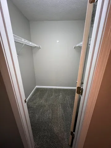 a kitchen with a sink and wooden floor