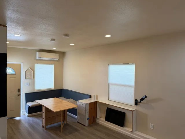 a workspace with furniture and wooden floor