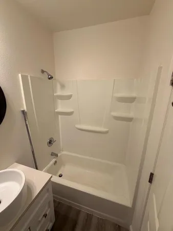 a bathroom with a bathtub and a toilet