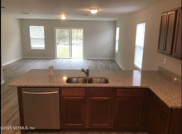 a kitchen with a sink and a window