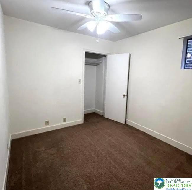 606 West Broad Street, Unit F Bethlehem, PA 18018 - Photo 8 of 12 an empty room with a ceiling fan and a window
