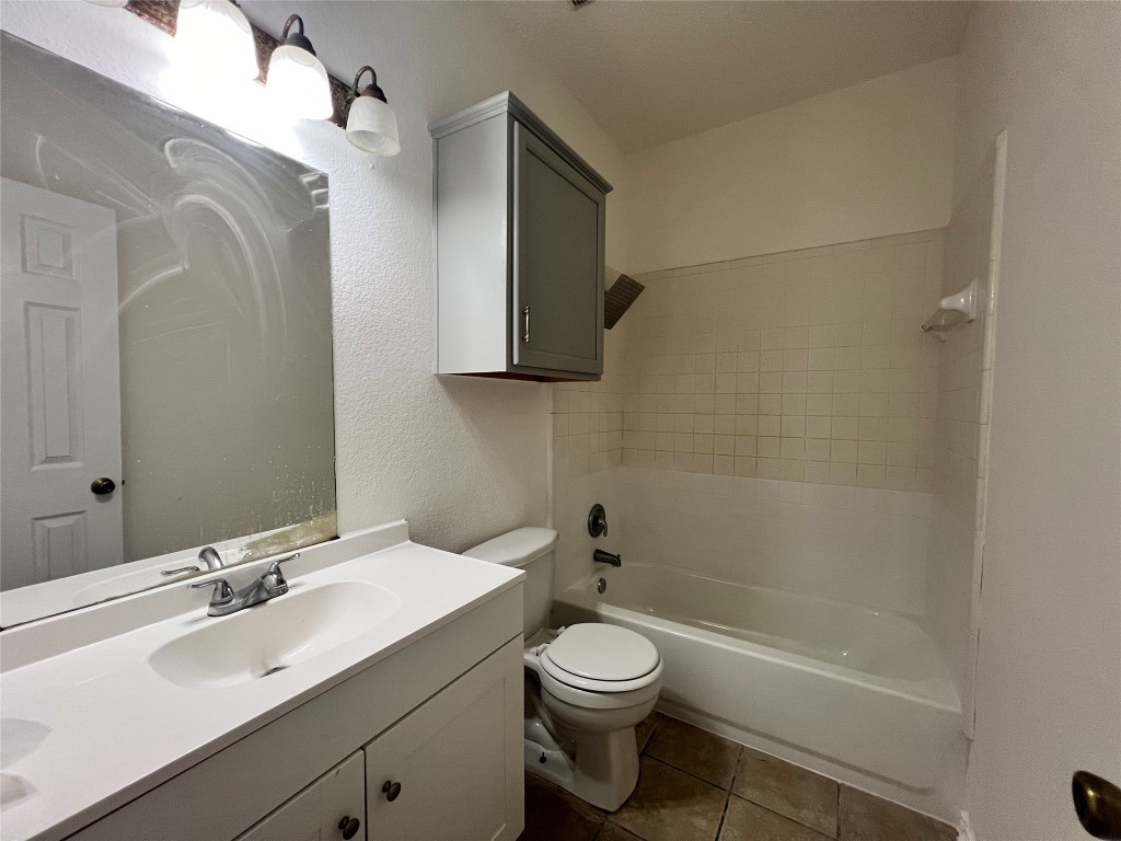 1525 Natural Bridge Lane Pflugerville, TX 78660 - Photo 13 of 15 a bathroom with a sink toilet and shower