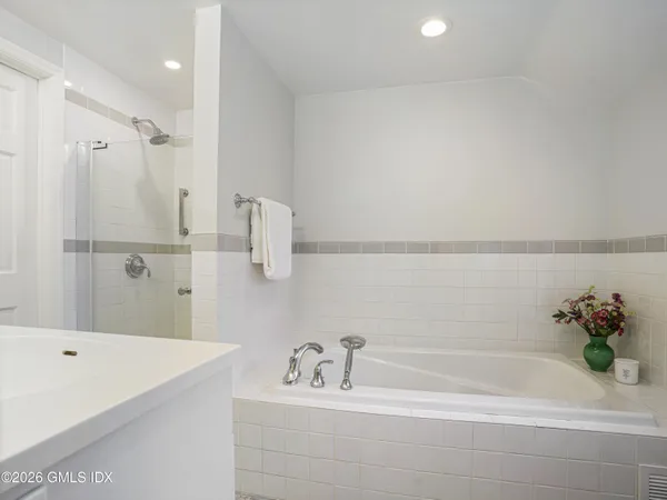 a living room with furniture and a book shelf