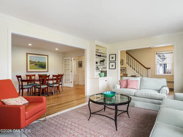 a view of a dining room with furniture and wooden floor