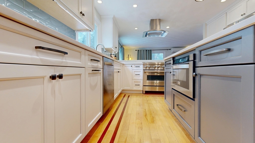 990 Forest Street North Andover, MA 01845 - Photo 15 of 42 a view of a kitchen with wooden floor and electronic appliances