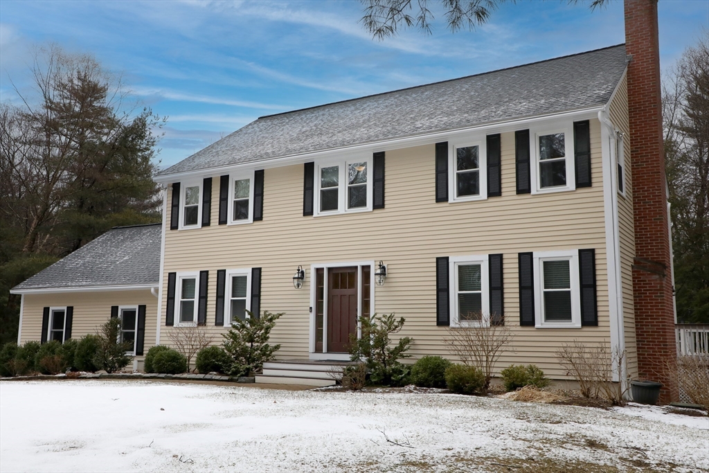 990 Forest Street North Andover, MA 01845 - Photo 2 of 42 a front view of a house with a yard