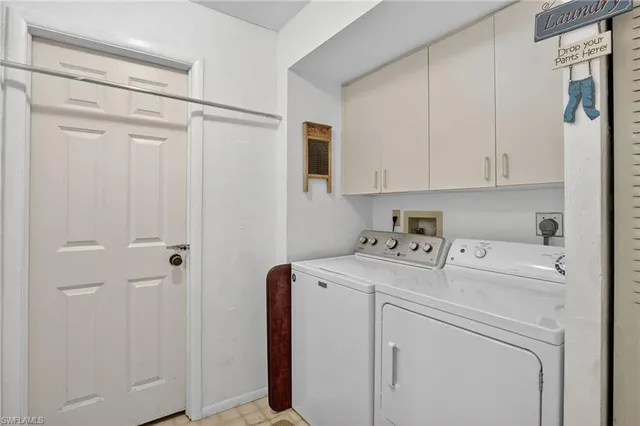 a view of storage and utility room with washer and dryer