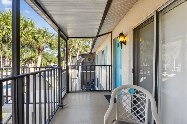 a view of a porch with wooden floor
