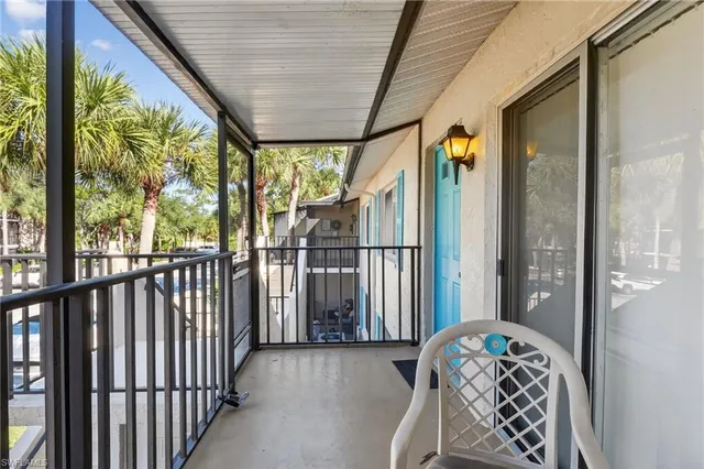a view of a porch with wooden floor