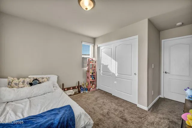 a bed room with a bed and a window