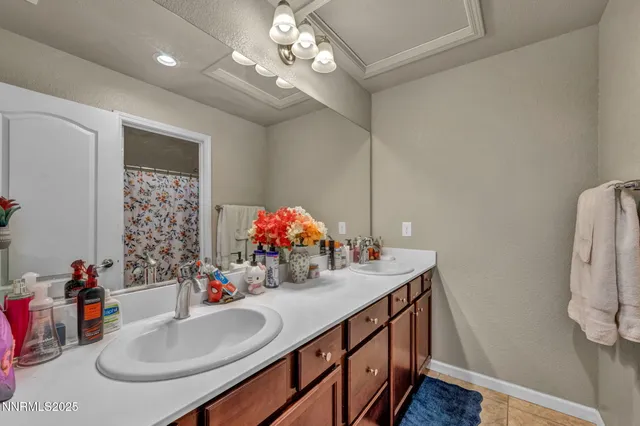a bathroom with a sink double vanity and a mirror