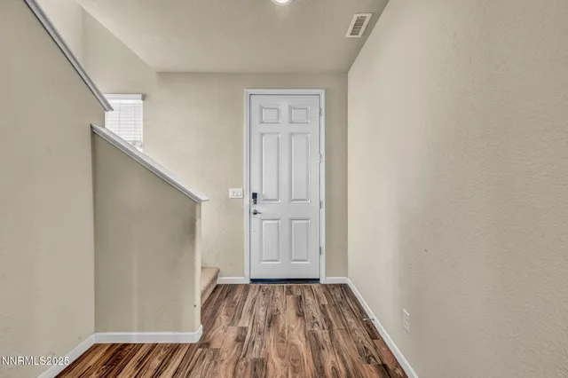 a view of an empty room with closet