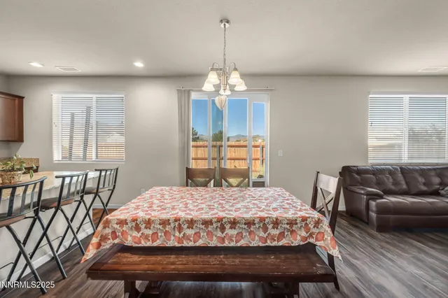 a bedroom with a bed a couch and dresser