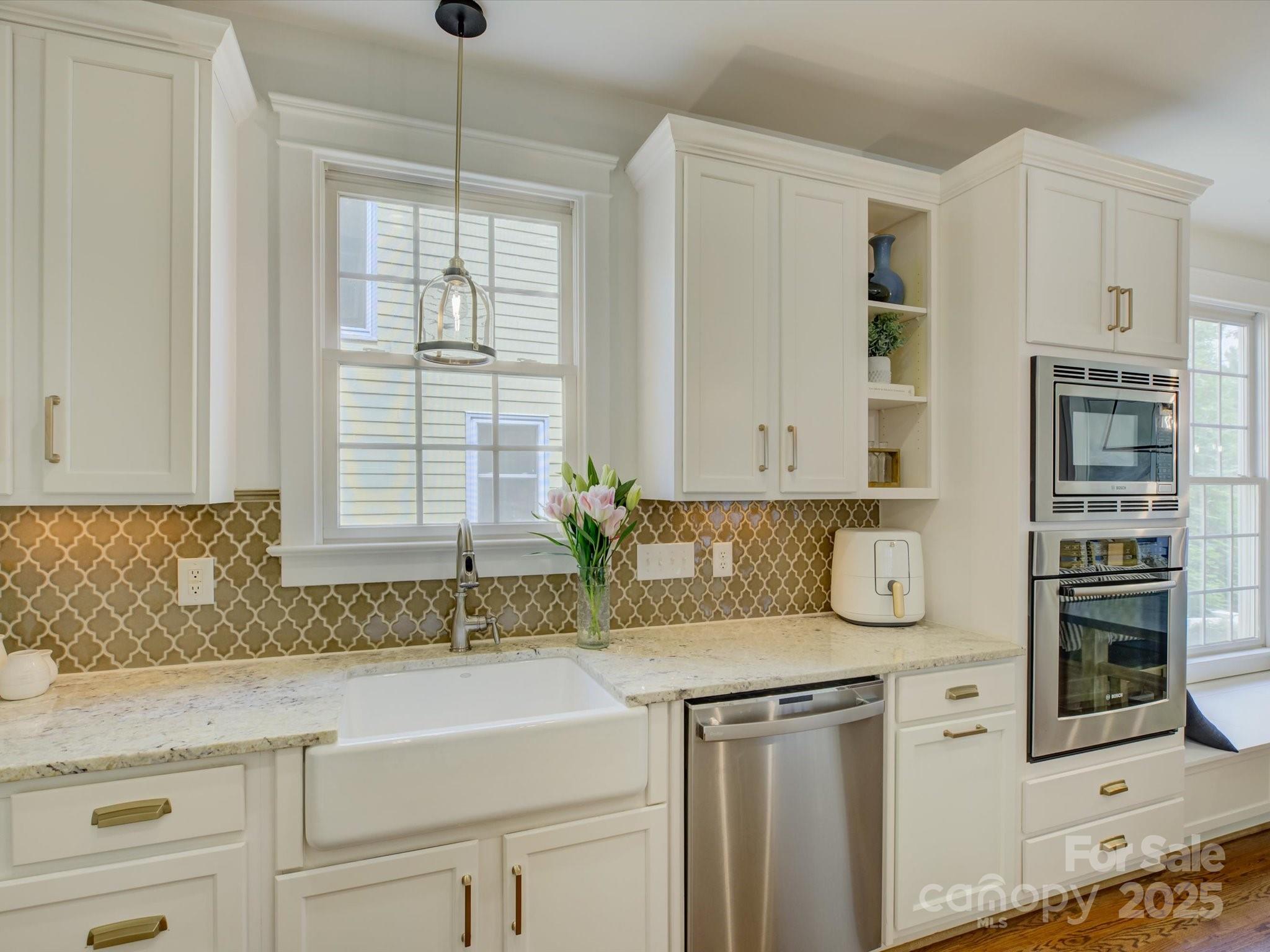 628 Bracket Street Fort Mill, SC 29708 - Photo 11 of 48 a kitchen with stainless steel appliances granite countertop a sink and a granite counter tops