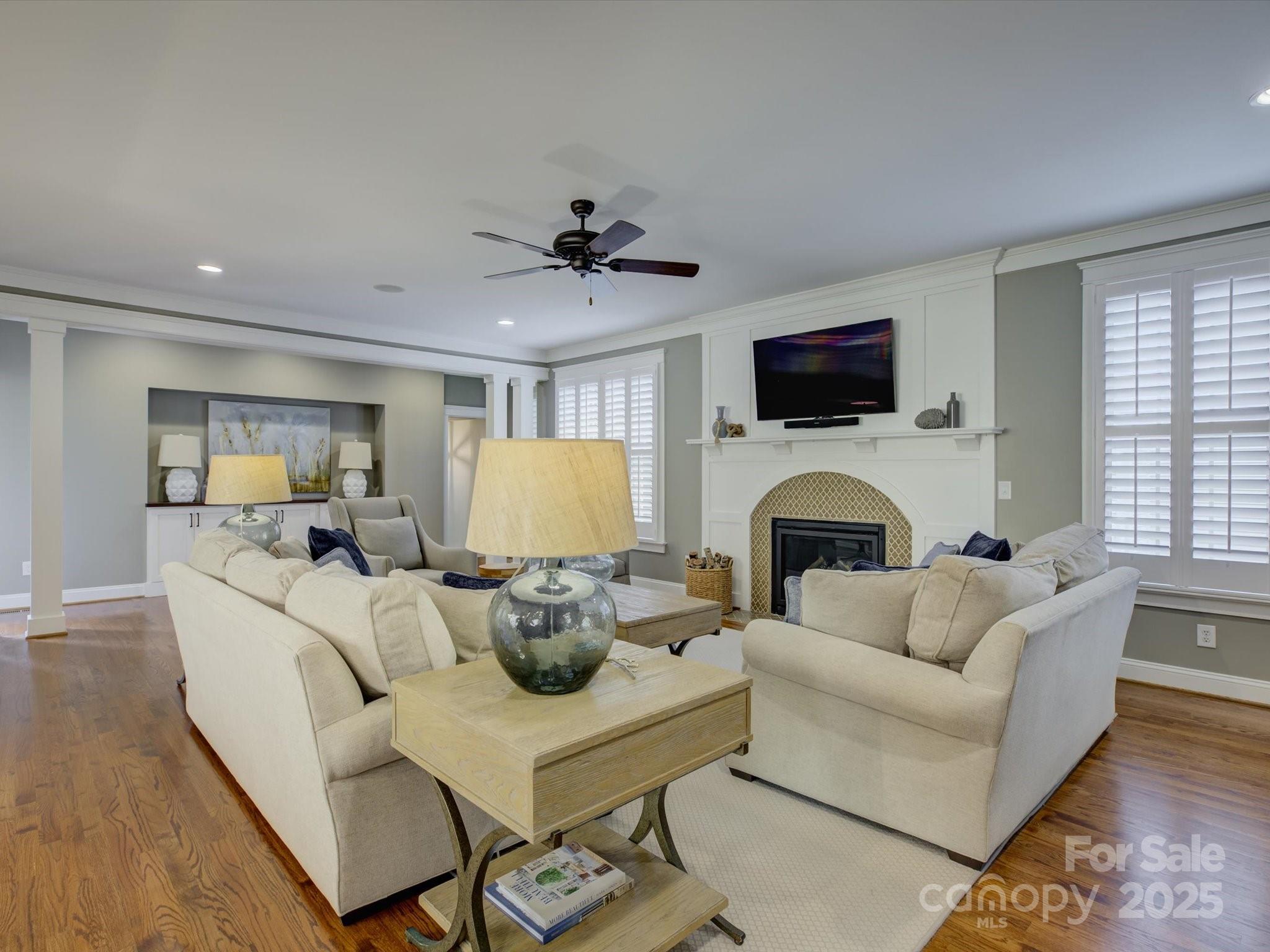 628 Bracket Street Fort Mill, SC 29708 - Photo 14 of 48 a living room with furniture a fireplace and a flat screen tv
