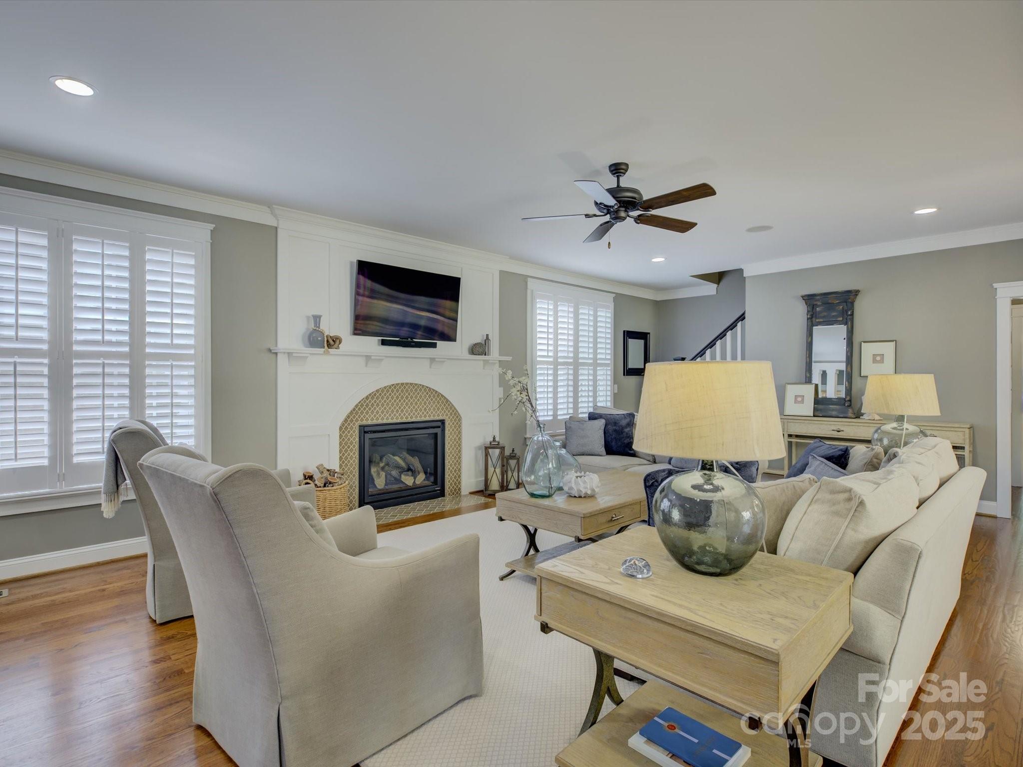628 Bracket Street Fort Mill, SC 29708 - Photo 15 of 48 a living room with furniture a fireplace and a flat screen tv