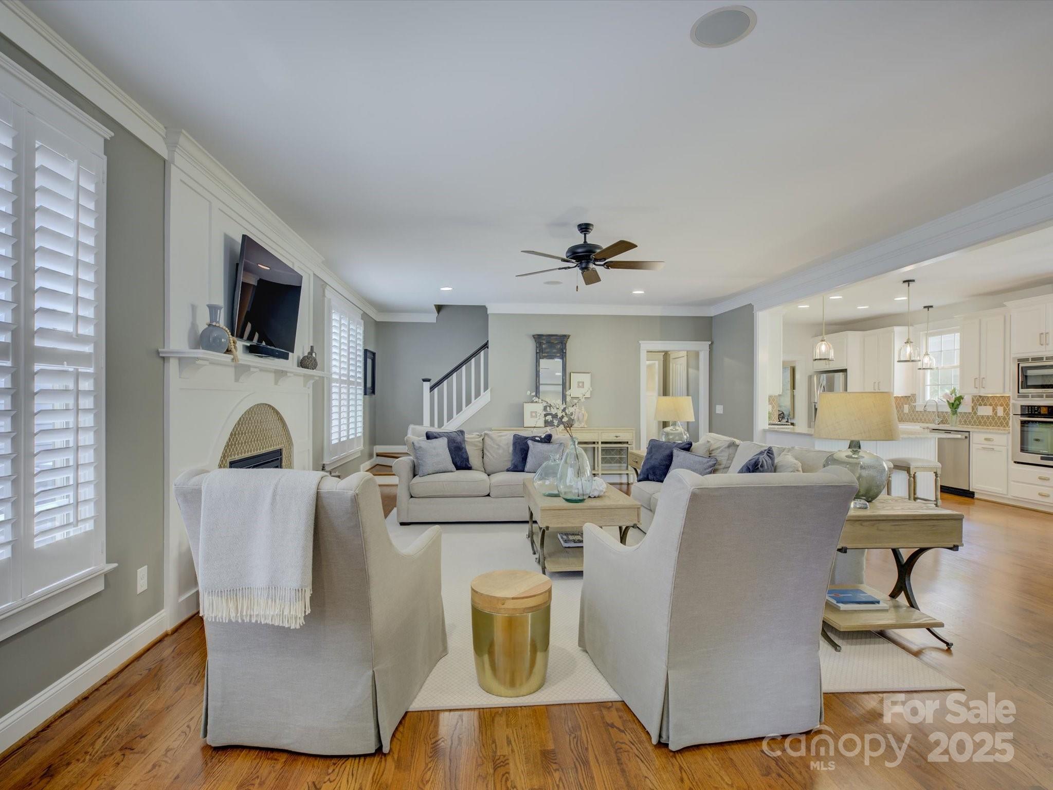 628 Bracket Street Fort Mill, SC 29708 - Photo 16 of 48 a living room with furniture a flat screen tv and a fireplace