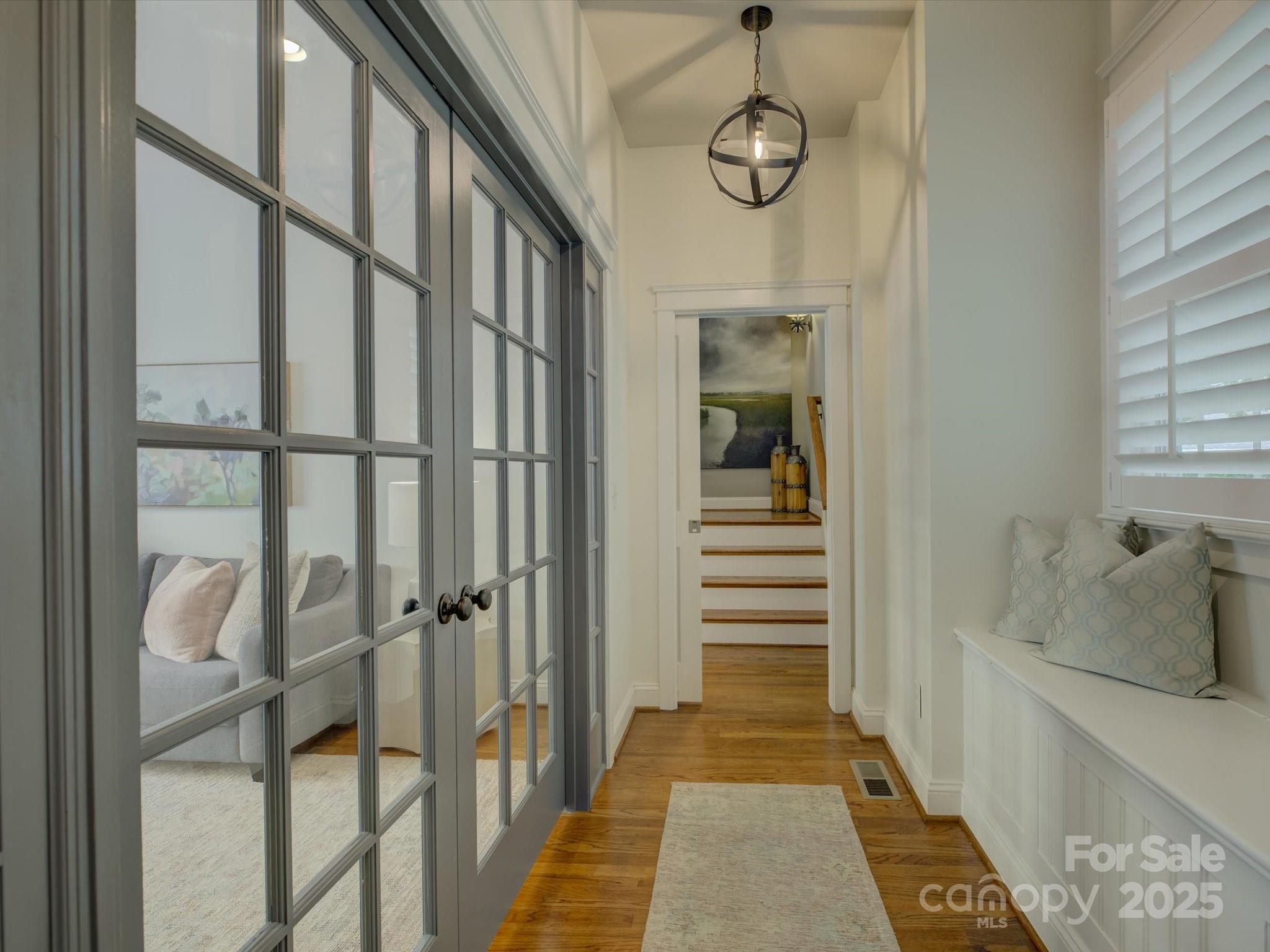 628 Bracket Street Fort Mill, SC 29708 - Photo 18 of 48 a view of a hallway with wooden floor and staircase