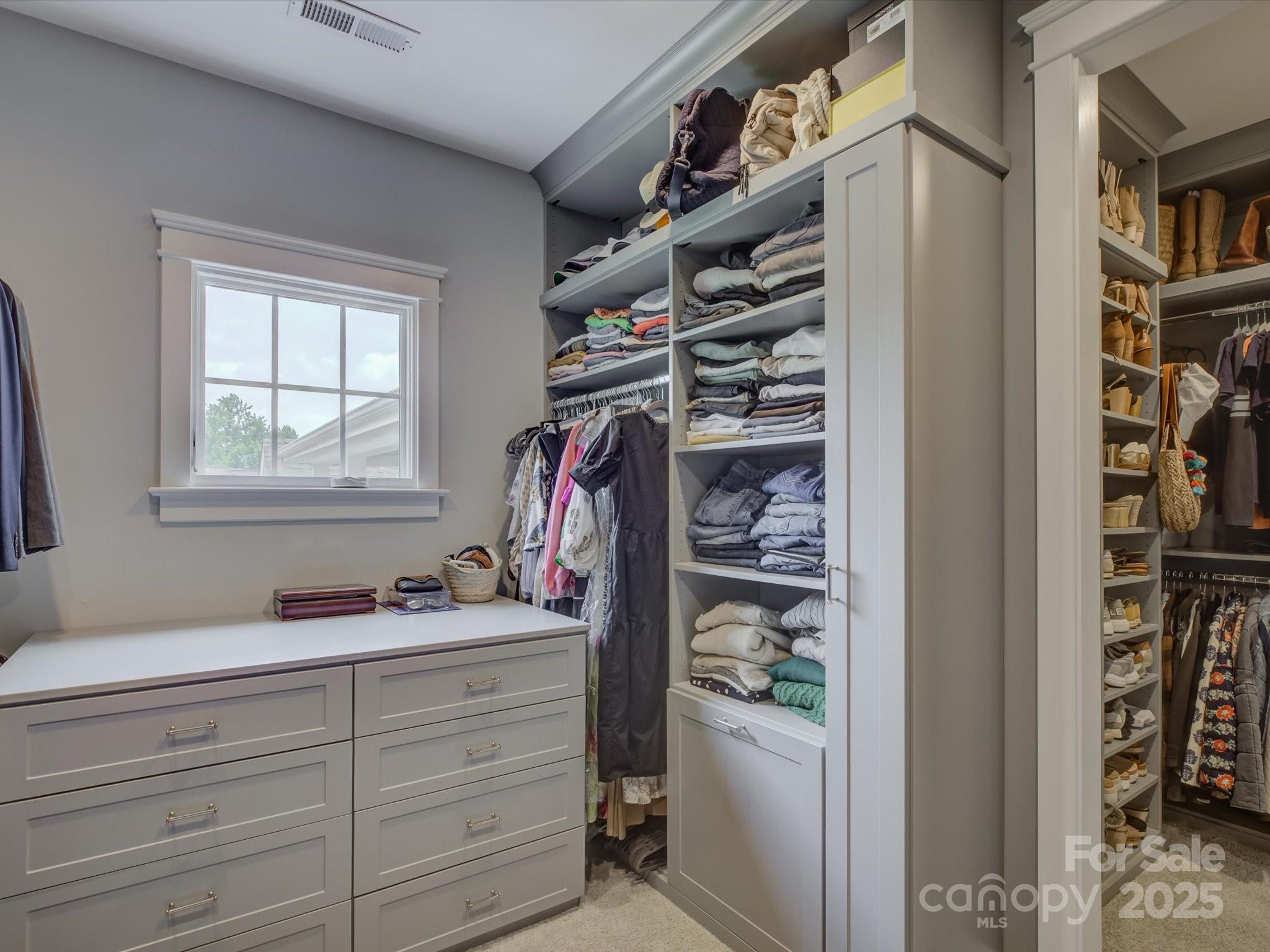 628 Bracket Street Fort Mill, SC 29708 - Photo 26 of 48 a view of walk in closet with clothes and shoes