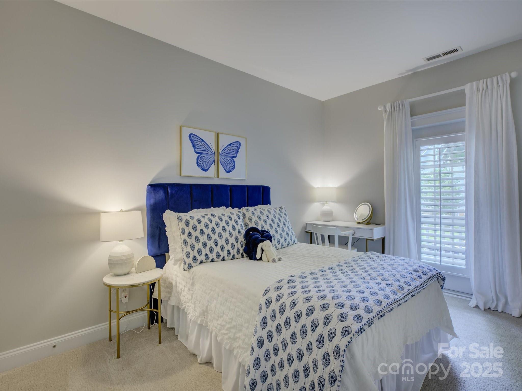 628 Bracket Street Fort Mill, SC 29708 - Photo 28 of 48 a bedroom with a bed and a lamp