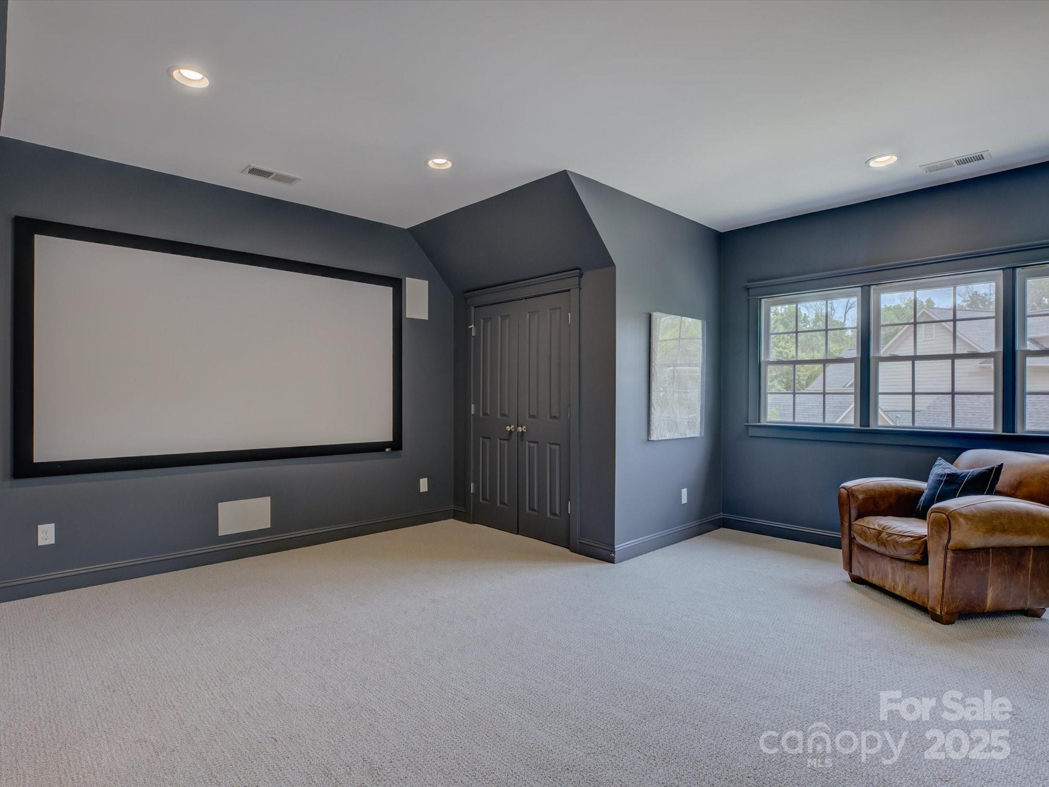628 Bracket Street Fort Mill, SC 29708 - Photo 34 of 48 a living room with furniture gym equipment and a large window